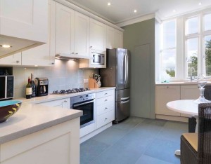 Hand-painted Kitchen with Corian worksurfaces.
