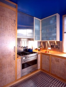 Limed Burr Oak veneered doors with European Oak carcases.  Solid Maple worktop and stainless steel splash-back.