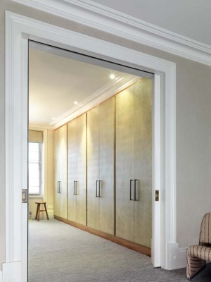 Dressing Room Wardrobe made with an Walnut interior and Shagreen covered doors.
