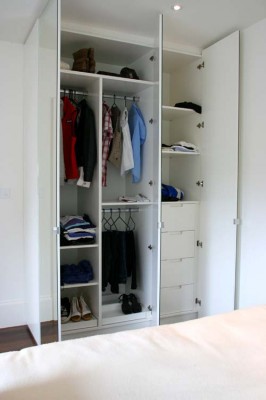 Mirrored door Wardrobes with white spray-painted interiors.