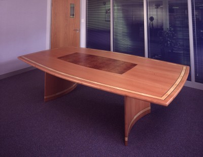 Boardroom Table made from Steamed Swiss Pear, Amboyna, Figured Maple and Rosewood inlay.