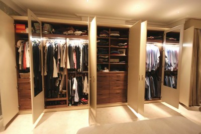 Wardrobes with spray-painted doors and Walnut interior.
