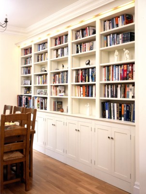 Hand-painted bookcase with integral cornice lighting.